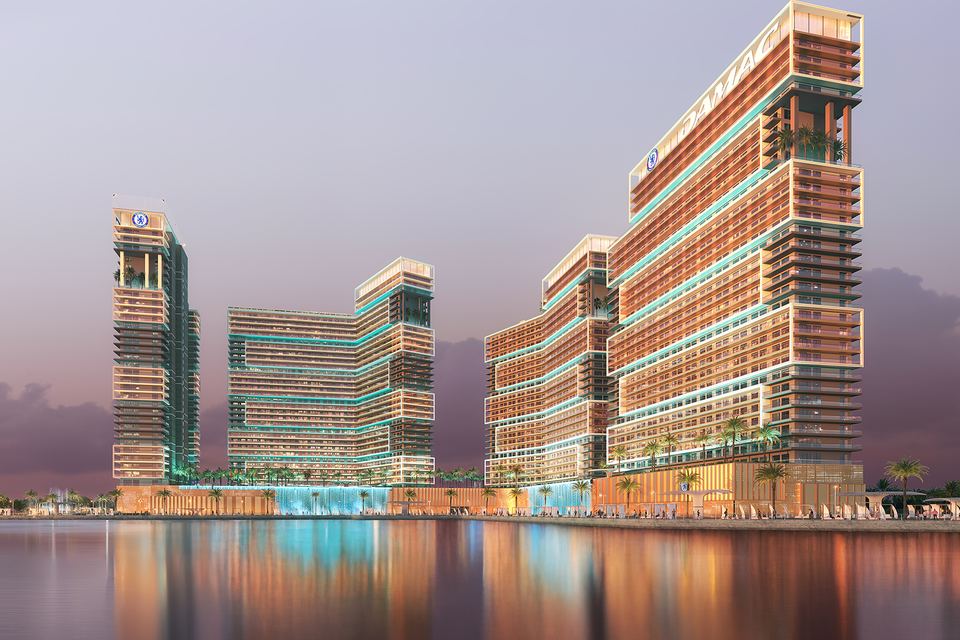 Render of the towers on the waterfront at dusk, reflected in the water
