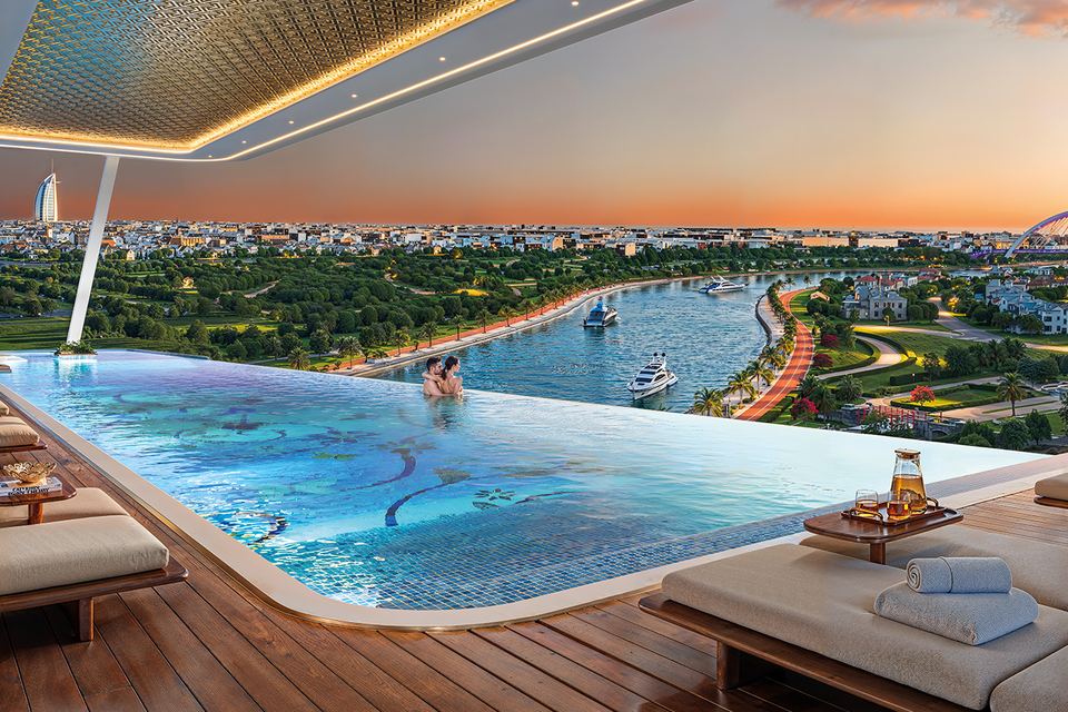Render of the elevated infinity pool with sun loungers overlooking the Dubai Canal at sunset