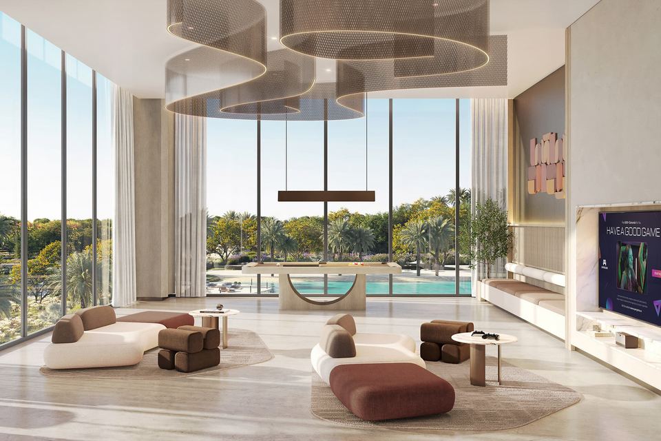 Double-height club lounge with seating looking out to the pool deck
