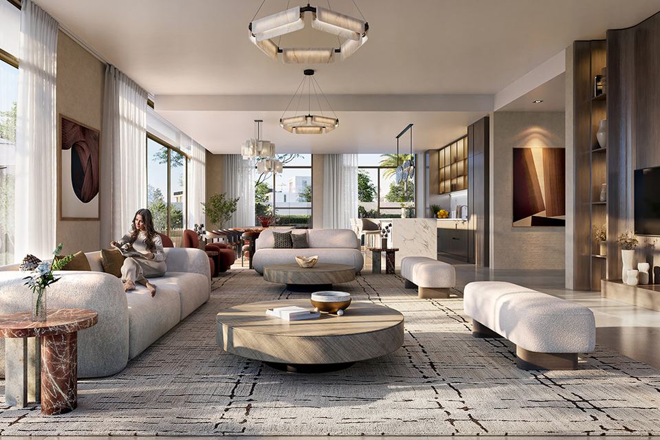 Double-height living room with pale sofas and a garden view