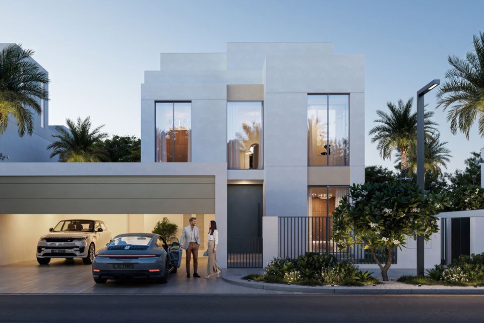 White contemporary villa with a covered carport and palm trees