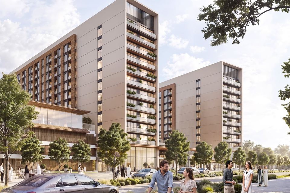 Street-level view of The Woods Abode apartment blocks with landscaped frontage